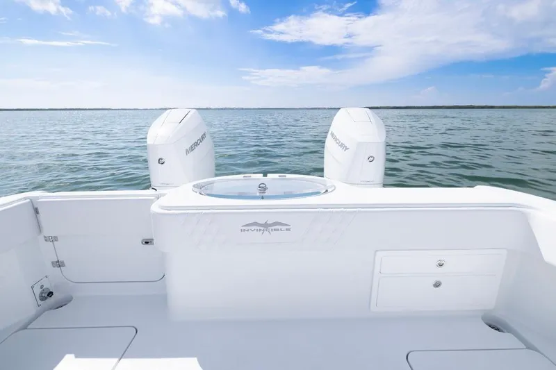  Yacht Photos Pics 2026 Invincible 33 Catamaran on open water, featuring dual Mercury engines.