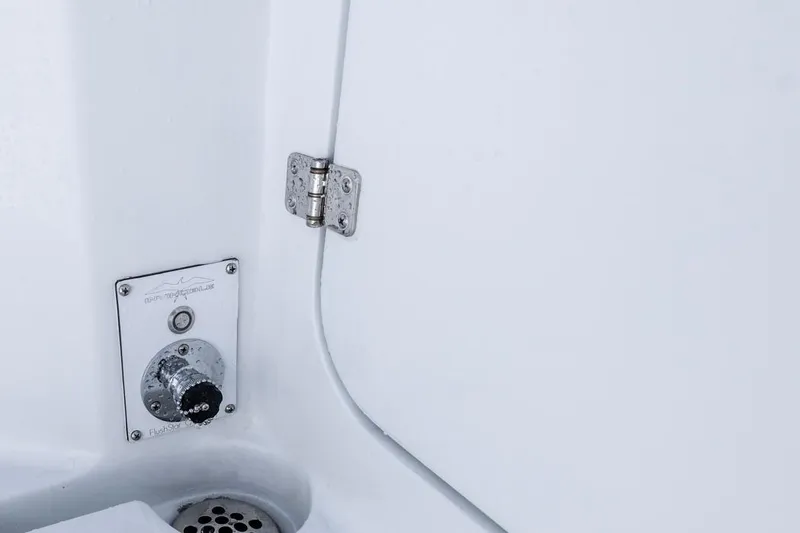  Yacht Photos Pics 2026 Invincible 33 Catamaran interior detail with hinge and control panel.