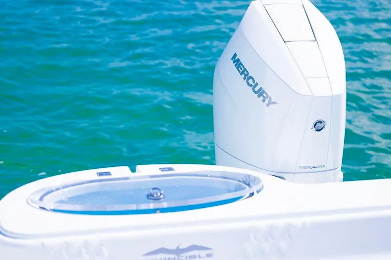  Yacht Photos Pics 2026 Invincible 33 Catamaran with Mercury Verado engine on blue water.