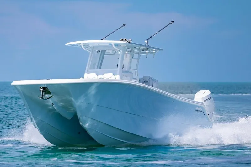  Yacht Photos Pics Invincible 33 Catamaran 2026 cruising on open water, showcasing sleek design and performance.