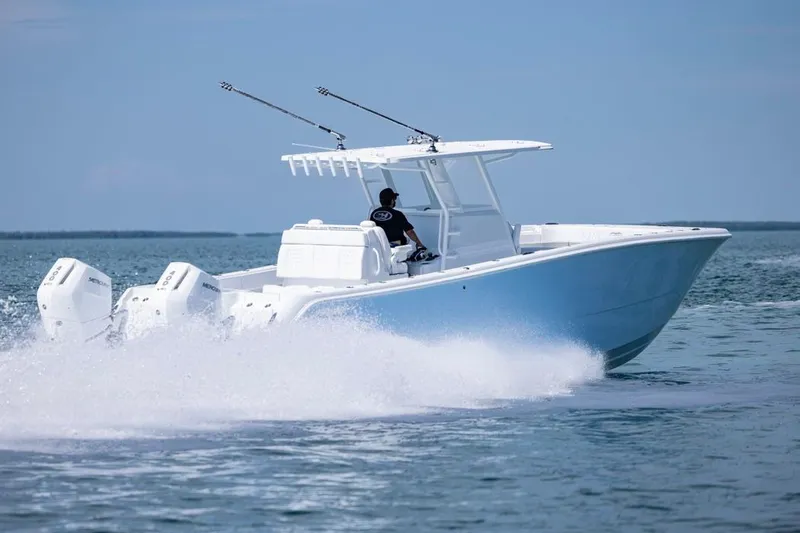  Yacht Photos Pics 2026 Invincible 33 Catamaran cruising on open water, showcasing powerful engines and sleek design.