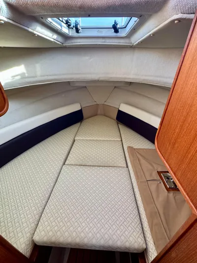 Lone Ranger Yacht Photos Pics 2017 Ranger Tugs Sedan interior cabin with cushioned seating and overhead skylight.