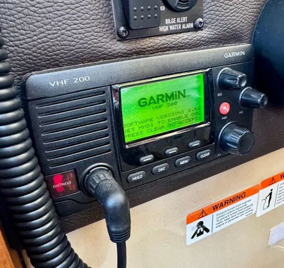 Lone Ranger Yacht Photos Pics Garmin VHF 200 radio on 2017 Ranger Tugs Sedan dashboard with warning labels.