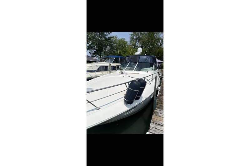  Yacht Photos Pics 2004 Cruisers Yachts 400 Express docked, featuring sleek design and modern amenities.