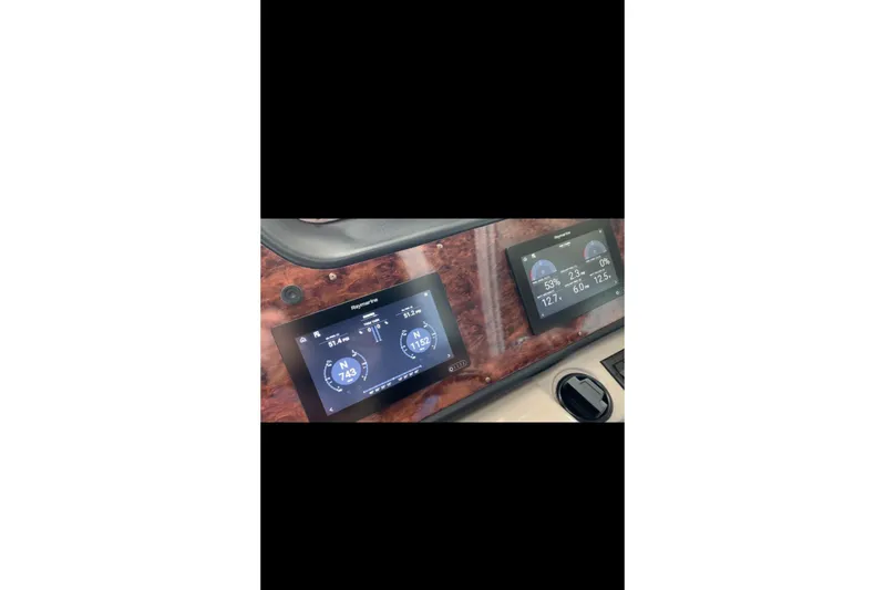  Yacht Photos Pics Dashboard of 2004 Cruisers Yachts 400 Express with navigation displays.