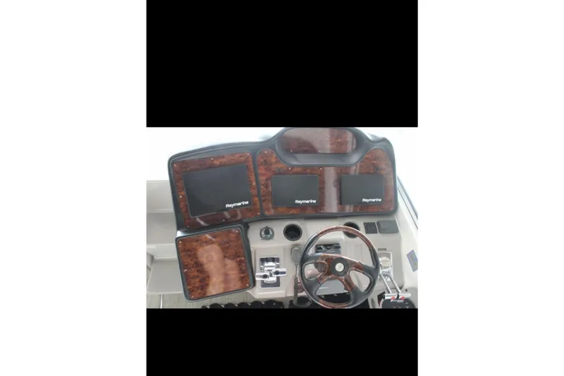  Yacht Photos Pics 2004 Cruisers Yachts 400 Express dashboard with Raymarine navigation displays.