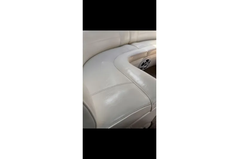  Yacht Photos Pics 2004 Cruisers Yachts 400 Express interior seating with built-in speaker.