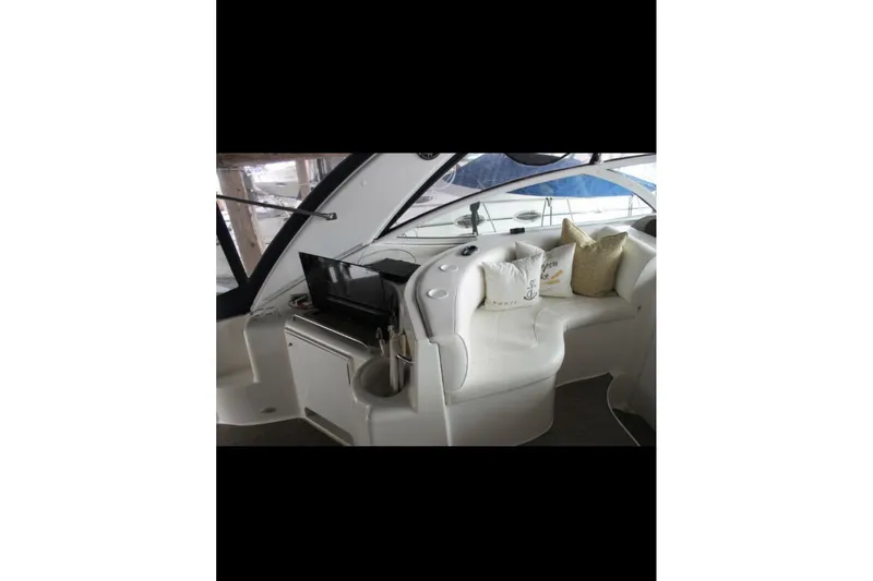  Yacht Photos Pics 2004 Cruisers Yachts 400 Express interior with white seating and pillows.