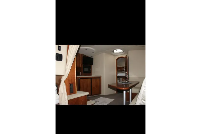  Yacht Photos Pics Interior of 2004 Cruisers Yachts 400 Express, featuring wood cabinetry and modern amenities.