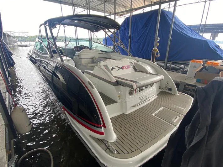  Yacht Photos Pics 2012 Formula 350 SS FX6 boat docked under a covered marina.