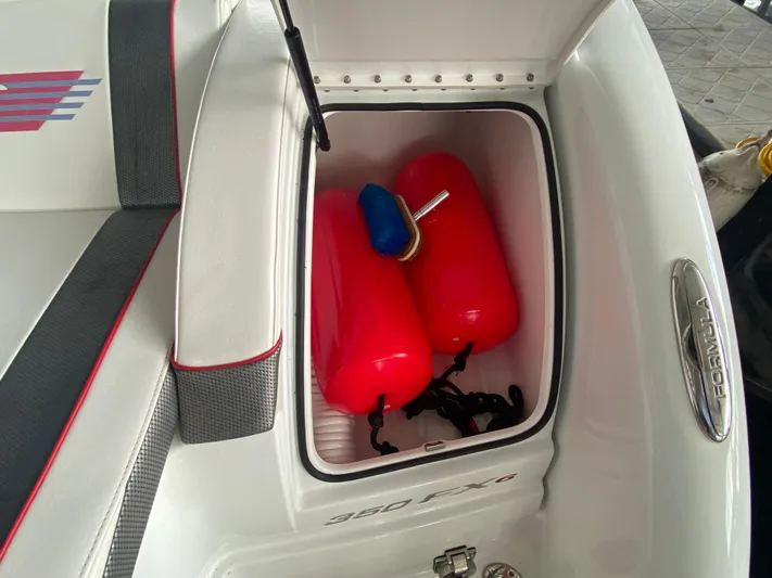  Yacht Photos Pics 2012 Formula 350 SS FX6 boat storage compartment with red fenders.