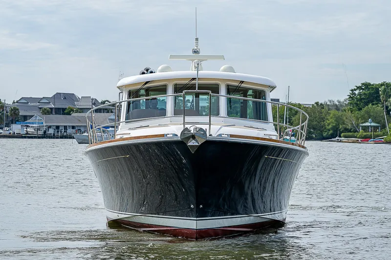 Captain And The Kid Yacht Photos Pics 2012 Sabre 48 Salon Express yacht on calm water, front view.