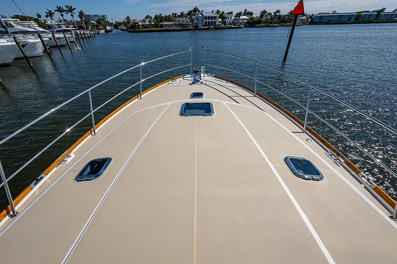 Captain And The Kid Yacht Photos Pics 2012 Sabre 48 Salon Express yacht deck on calm water, showcasing sleek design and luxury.