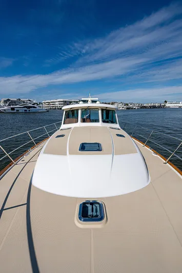 Captain And The Kid Yacht Photos Pics 2012 Sabre 48 Salon Express yacht on calm water under blue sky.
