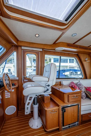 Captain And The Kid Yacht Photos Pics Interior of 2012 Sabre 48 Salon Express yacht with luxurious seating and wood finish.