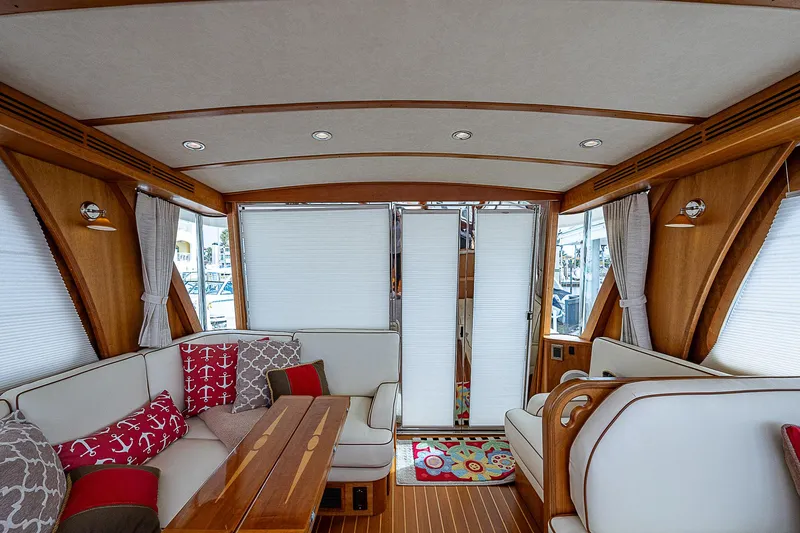 Captain And The Kid Yacht Photos Pics Interior of 2012 Sabre 48 Salon Express yacht with elegant wood finish and cozy seating.