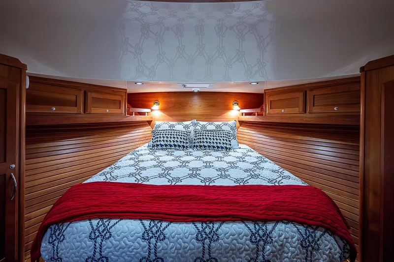 Captain And The Kid Yacht Photos Pics Luxurious bedroom interior of 2012 Sabre 48 Salon Express yacht with elegant bedding.