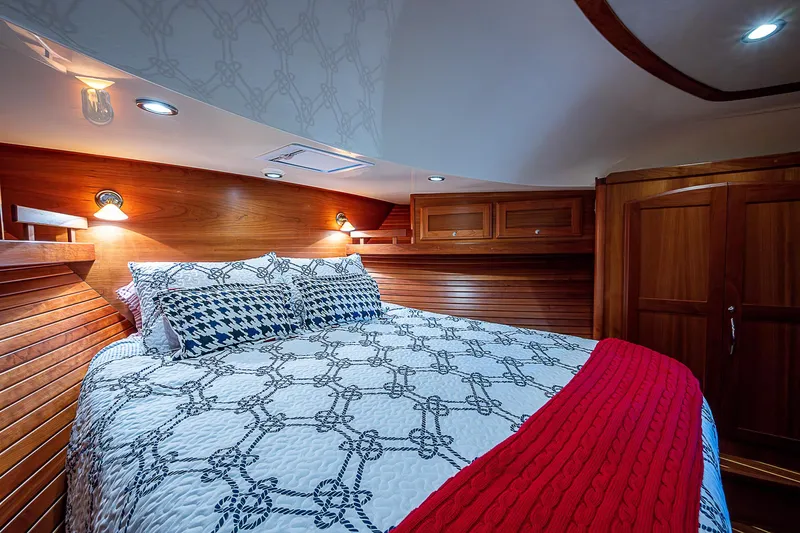 Captain And The Kid Yacht Photos Pics Luxurious bedroom interior of 2012 Sabre 48 Salon Express yacht with elegant bedding.