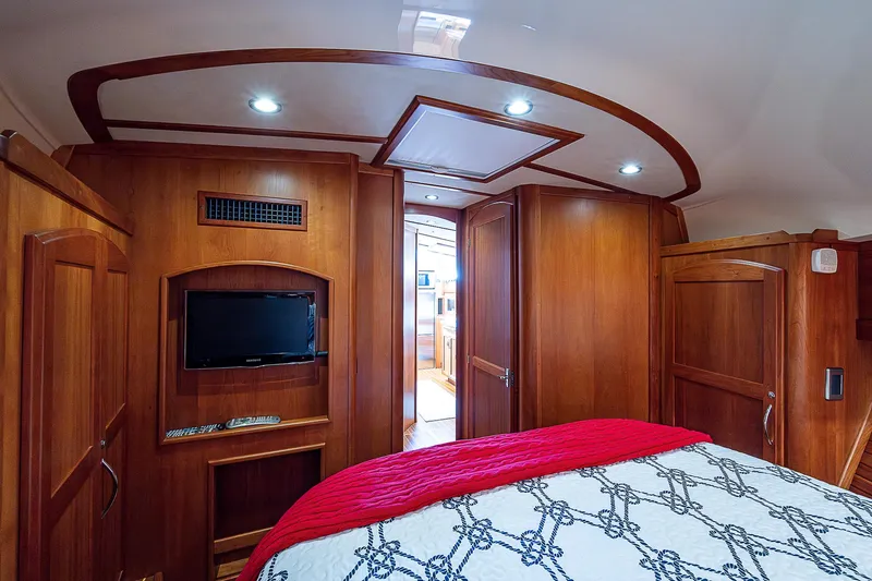 Captain And The Kid Yacht Photos Pics Luxurious interior of 2012 Sabre 48 Salon Express yacht with wood paneling and modern amenities.