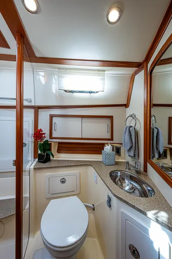 Captain And The Kid Yacht Photos Pics Luxurious bathroom in 2012 Sabre 48 Salon Express yacht with modern fixtures.
