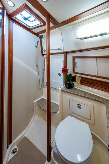 Captain And The Kid Yacht Photos Pics 2012 Sabre 48 Salon Express bathroom with shower, toilet, and vanity.