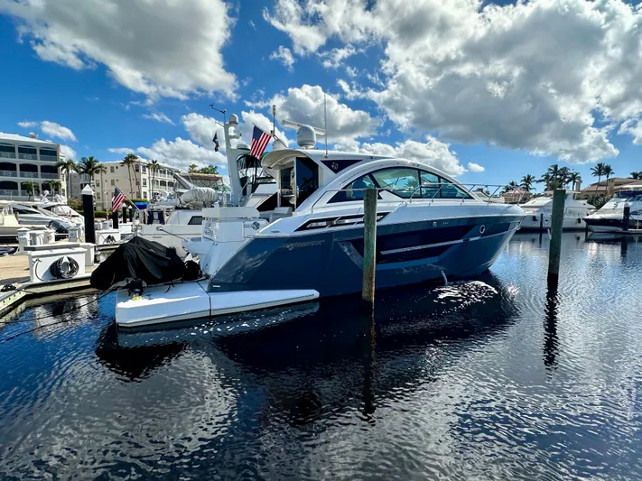 Yacht Photos Pics 2020 Cruisers Yachts 50 Cantius docked under a bright blue sky.