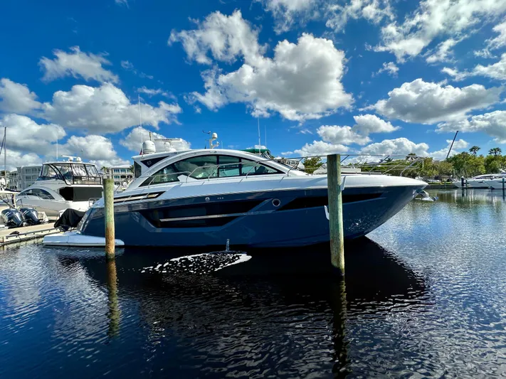  Yacht Photos Pics 2020 Cruisers Yachts 50 Cantius docked under a vibrant blue sky.