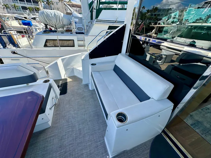  Yacht Photos Pics 2020 Cruisers Yachts 50 Cantius, outdoor seating area with modern design and cup holders.