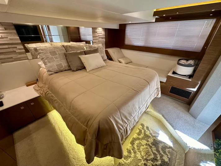  Yacht Photos Pics Luxurious bedroom interior of 2020 Cruisers Yachts 50 Cantius with modern decor and ambient lighting.