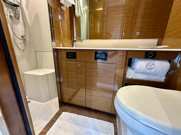  Yacht Photos Pics Luxurious bathroom in 2020 Cruisers Yachts 50 Cantius with modern fixtures and wood cabinetry.
