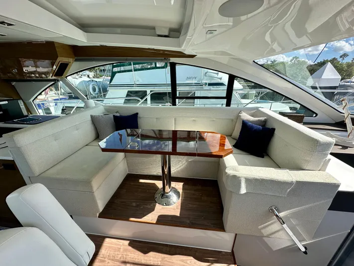  Yacht Photos Pics Luxurious interior of 2020 Cruisers Yachts 50 Cantius with elegant seating and table.