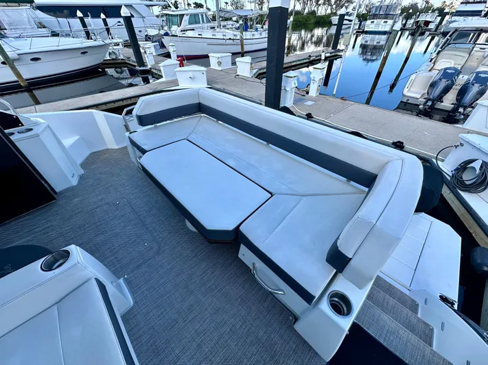  Yacht Photos Pics 2020 Cruisers Yachts 50 Cantius with spacious seating at marina dock.