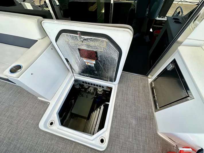  Yacht Photos Pics Open hatch on 2020 Cruisers Yachts 50 Cantius, revealing engine compartment.