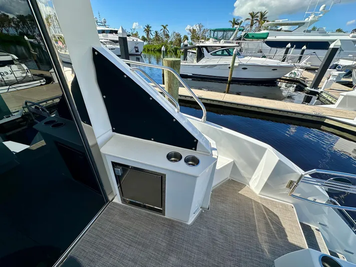  Yacht Photos Pics 2020 Cruisers Yachts 50 Cantius docked, featuring sleek deck design and marina view.