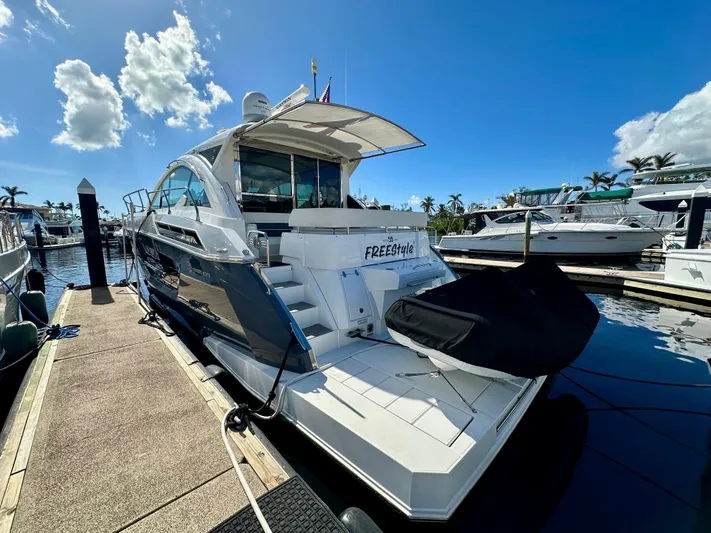  Yacht Photos Pics 2020 Cruisers Yachts 50 Cantius docked under clear blue sky.