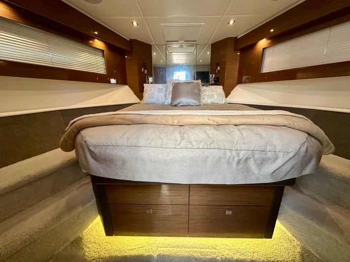  Yacht Photos Pics Luxurious bedroom interior of 2020 Cruisers Yachts 50 Cantius with elegant lighting.