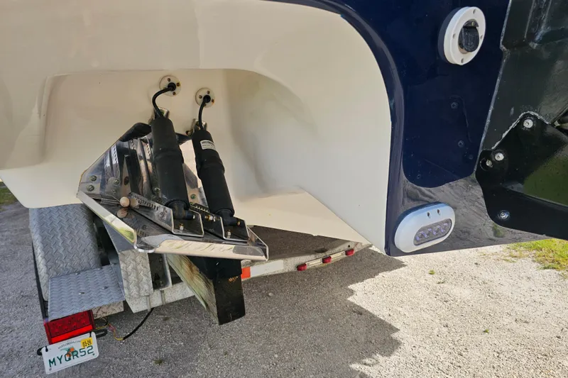  Yacht Photos Pics 2018 Tidewater 320 CC Adventure boat on trailer, showing trim tabs and rear details.