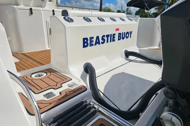  Yacht Photos Pics 2018 Tidewater 320 CC Adventure boat deck with "Beastie Buoy" nameplate.