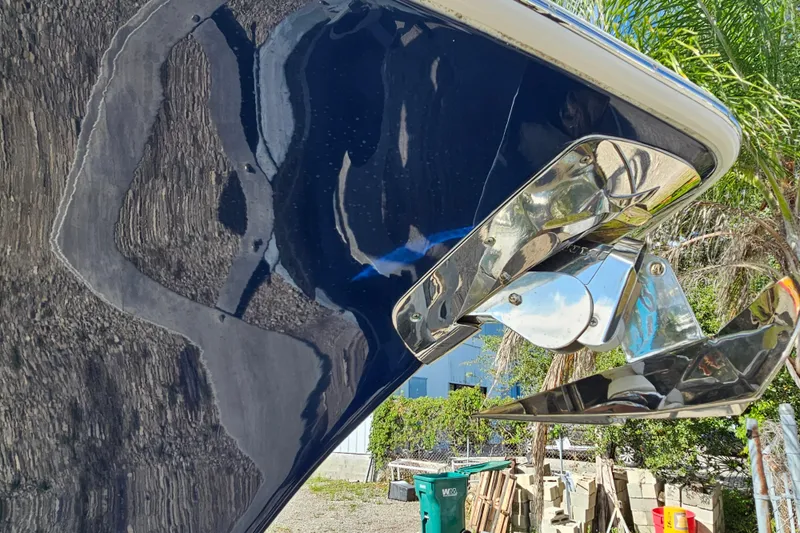  Yacht Photos Pics 2018 Tidewater 320 CC Adventure boat with shiny anchor detail, outdoors.