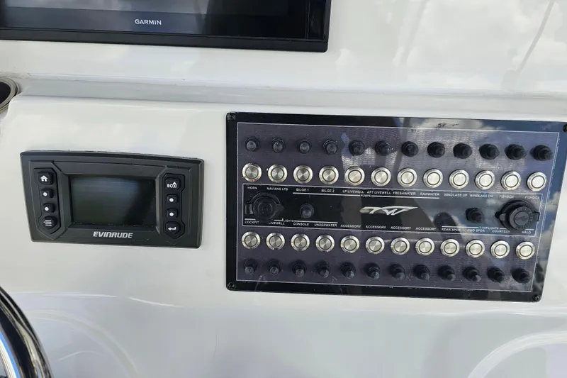 Yacht Photos Pics Control panel of a 2018 Tidewater 320 CC Adventure boat with Evinrude display.
