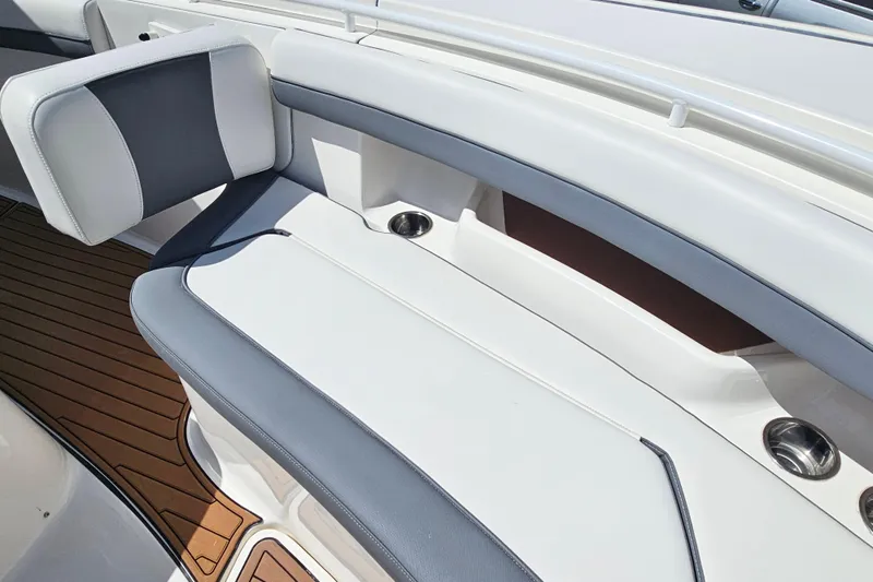  Yacht Photos Pics 2018 Tidewater 320 CC Adventure boat interior with cushioned seating and cup holders.