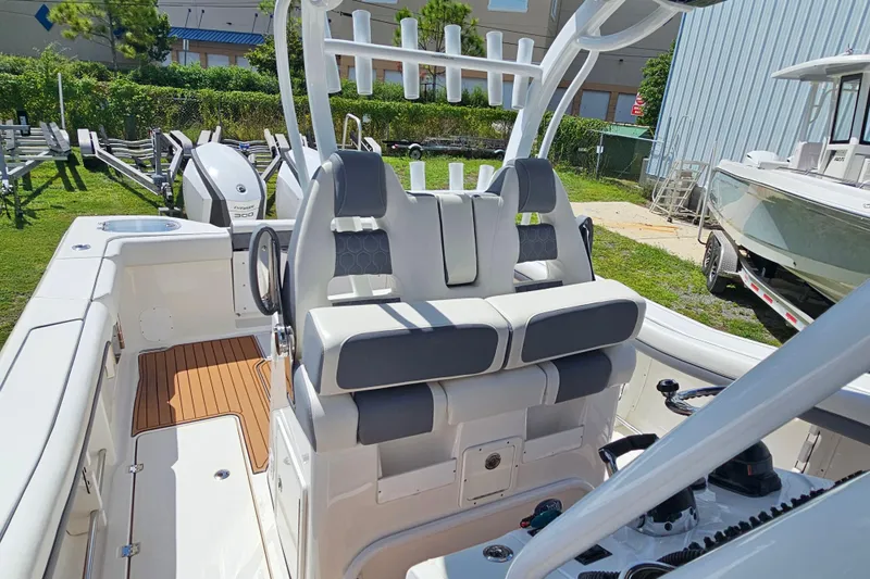  Yacht Photos Pics 2018 Tidewater 320 CC Adventure boat interior with dual seating and modern design.