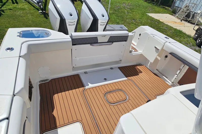  Yacht Photos Pics 2018 Tidewater 320 CC Adventure boat with teak flooring and dual Evinrude 300 engines.
