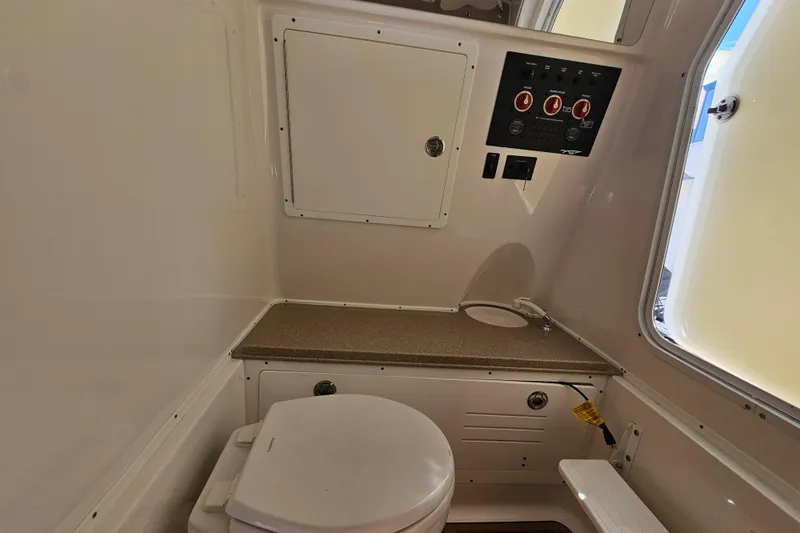  Yacht Photos Pics Interior of 2018 Tidewater 320 CC Adventure boat featuring a compact bathroom setup.