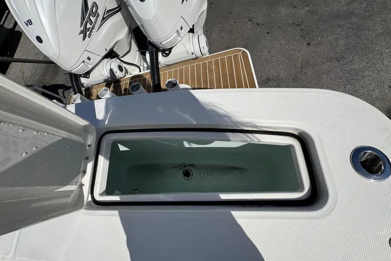  Yacht Photos Pics 2023 Regulator 31 boat with open livewell and twin outboard engines.