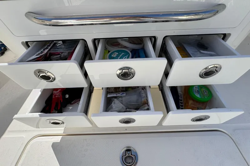  Yacht Photos Pics Open storage drawers on a 2023 Regulator 31 boat, containing various items.