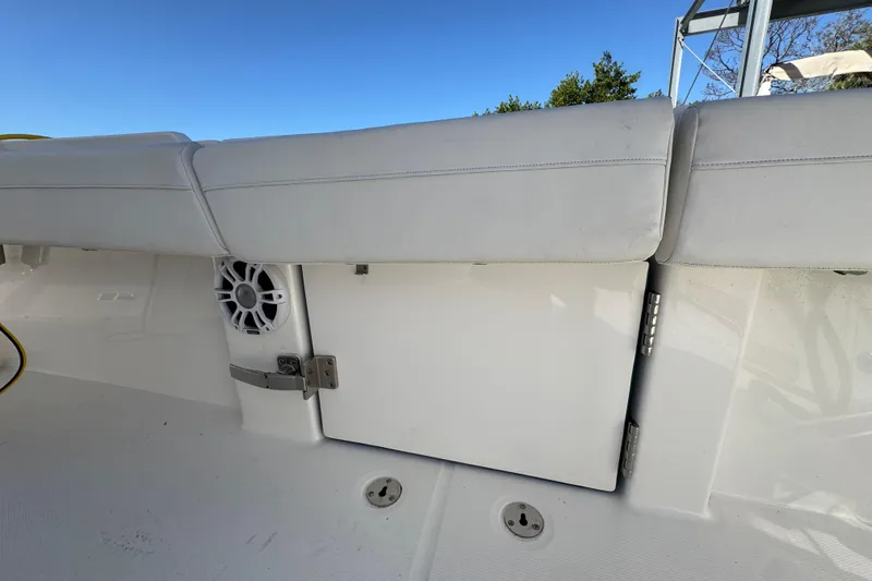  Yacht Photos Pics 2023 Regulator 31 boat interior with white seating and speaker detail.