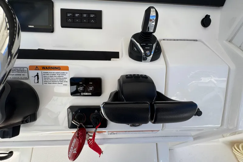  Yacht Photos Pics 2023 Regulator 31 boat control panel with Yamaha controls and warning label.