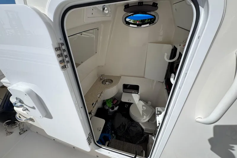  Yacht Photos Pics 2023 Regulator 31 boat interior cabin with toilet and sink.