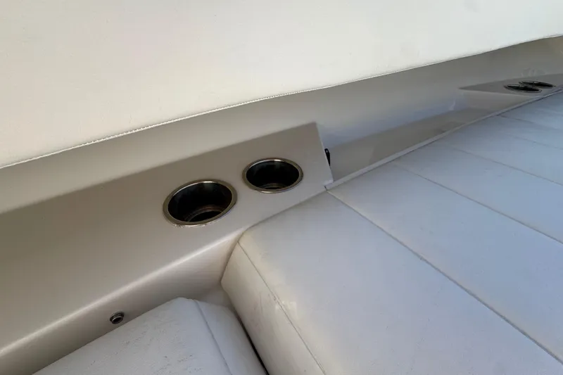  Yacht Photos Pics Interior of 2023 Regulator 31 boat featuring cup holders and cushioned seating.